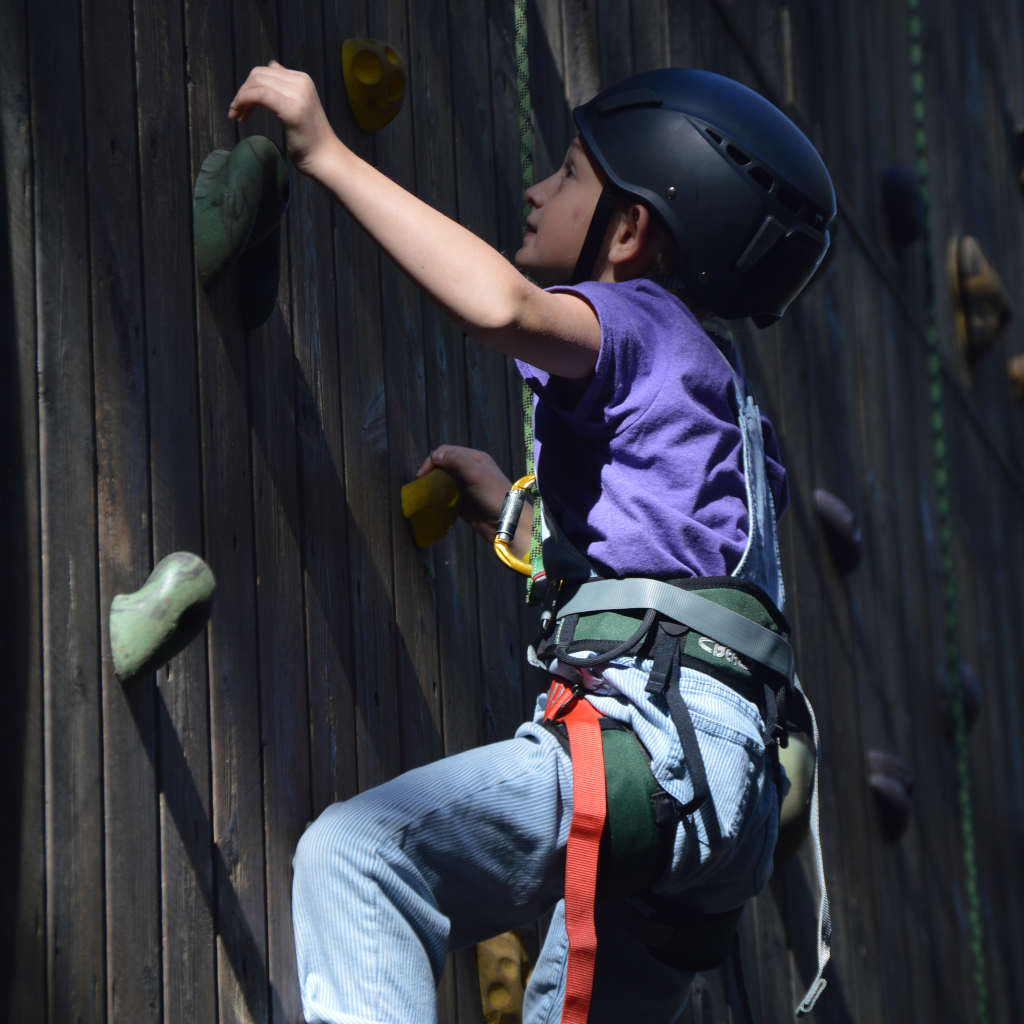 Girl climbing the wall at Gerber Scout Reservation