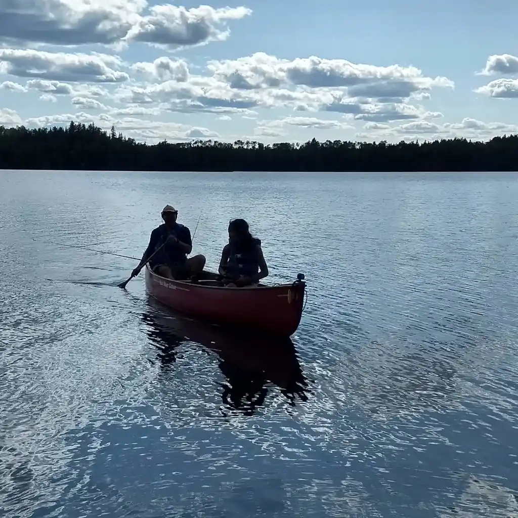 scout and a leader in a canoe at Boundary Waters MN, fishing